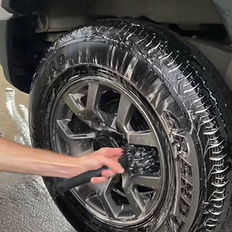 Close-up of Suzuki Jimny wheel being deep cleaned by Samurai Auto Detailing in Cairns — premium brake dust removal and tyre shine for a flawless finish.