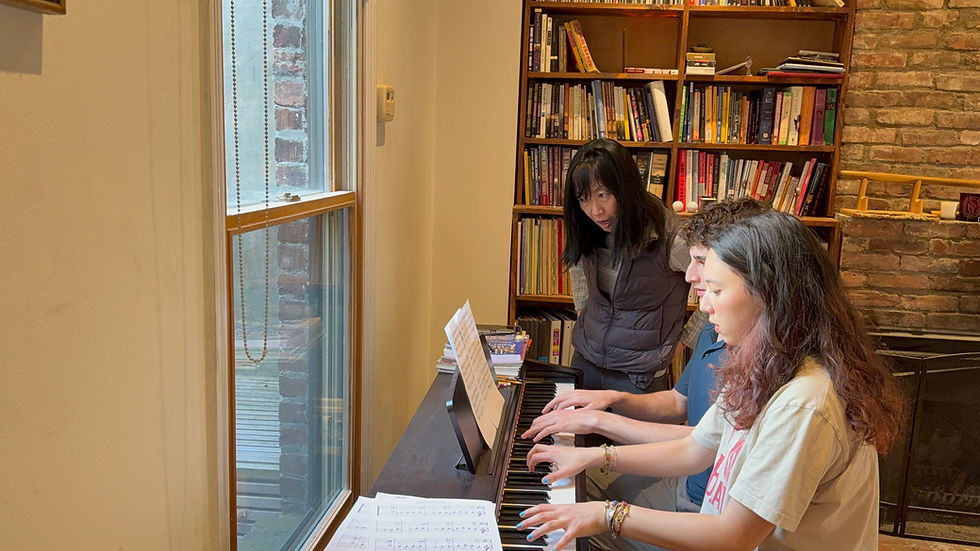 Eye-level view of a student playing piano in a cozy music room