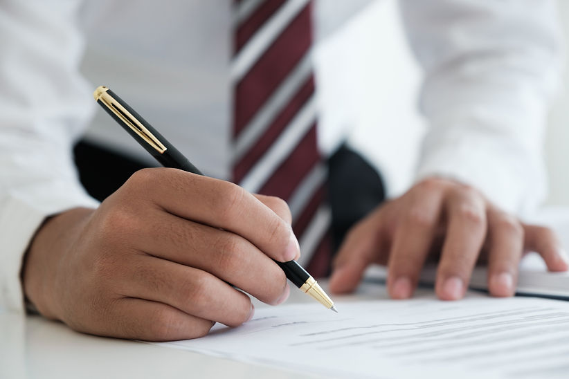 lawyer-signing-documents-near-mallet-and-scales-2022-08-01-03-19-49-utc.jpg