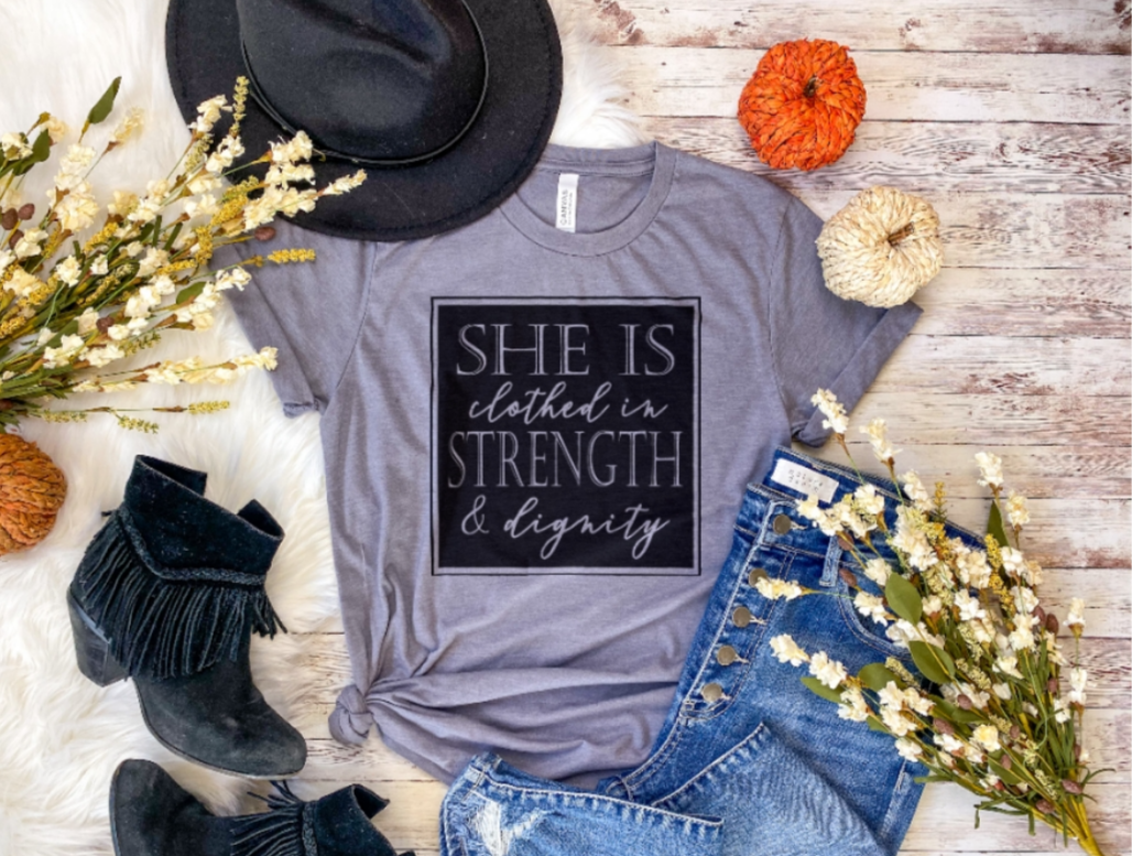 SHE IS CLOTHED IN STRENGTH & DIGNITY