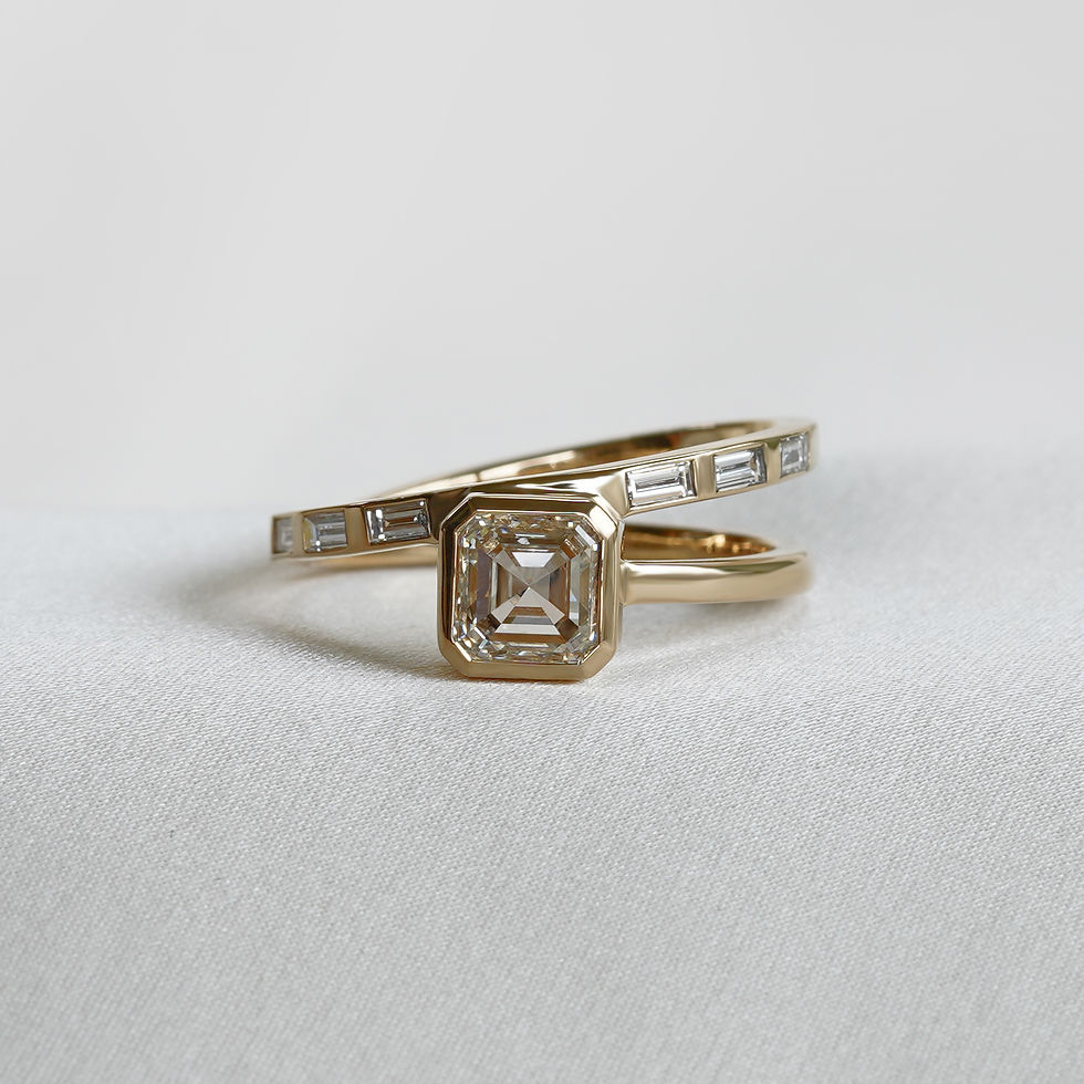 Thumbnail: Asscher cut engagement ring gold with baguette shoulder stones cohar jewellery. Angled band ring alternative engagement ring