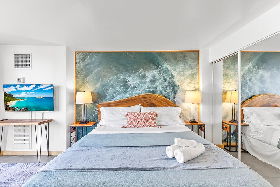 Modern bedroom with a king bed and ocean-inspired accent wall