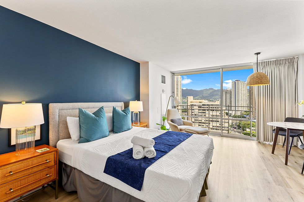 Bright studio with a queen bed, and private balcony offering city views