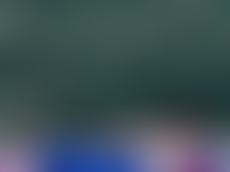 Elisha in Locust Pose (Salabhasana), lying prone with chest, arms, and legs lifted off the mat simultaneously