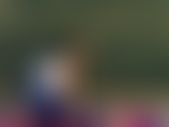 Elisha in Half Splits (Ardha Hanumanasana), front leg extended, hips shifted back, hands on blocks beside the front leg