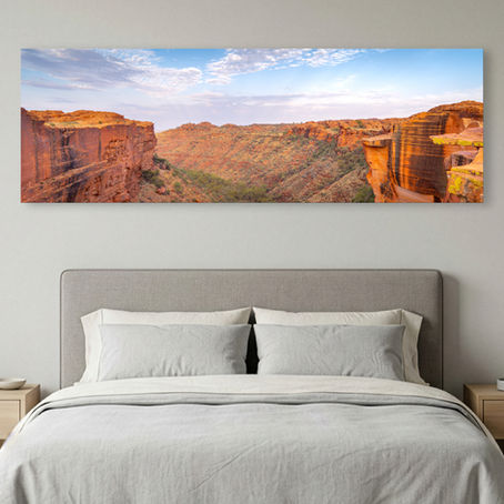 Metallic glass print hanging on wall showing panoramic Kings Canyon cliffs and valley