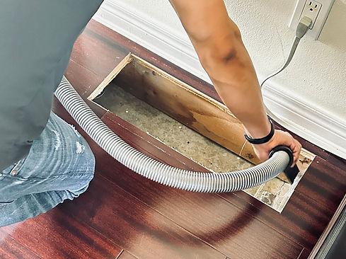 a cleaner cleans floot vents in a dep cleaning service