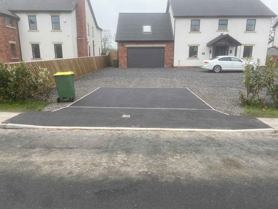 Photo of a Commercial/Domestic Service: Construction of a vehicle crossing to LCC specifications, including a hardstanding driveway area to prevent gravel from migrating onto the highway.