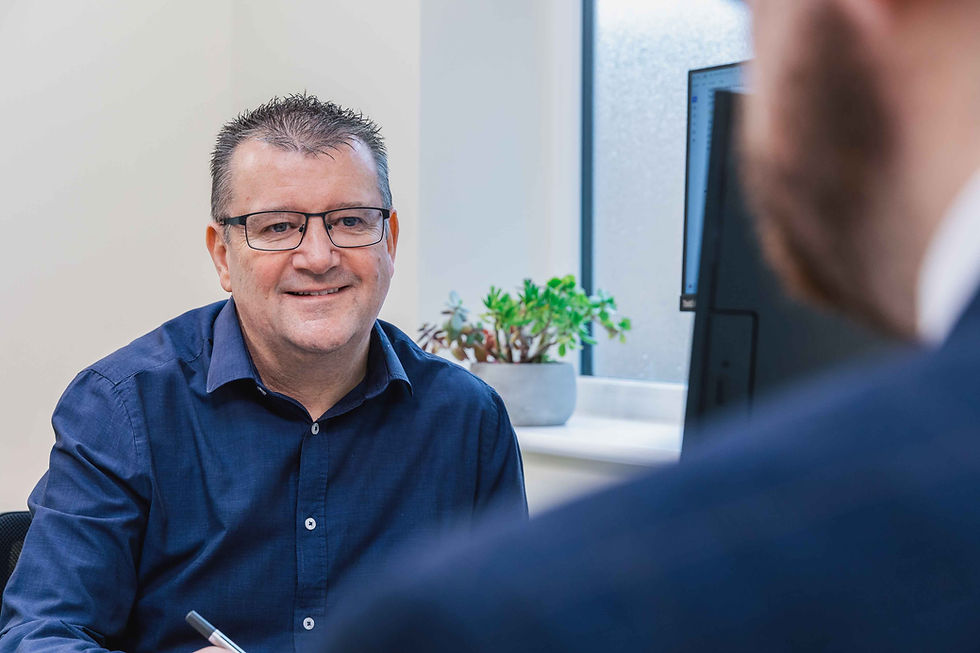 A photo of Arena's Office Manager, Mark talking to another person