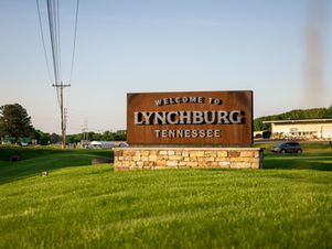 Welcome to Lynchburg sign sitting on a small hill as you come into town.