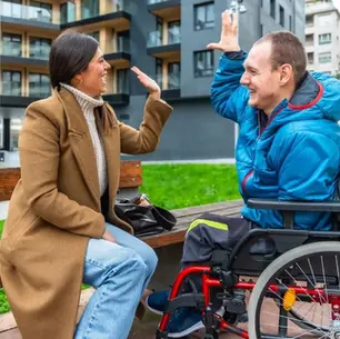 Florida mother celebrating with her adult son who uses a wheelchair, representing guardian succession planning
