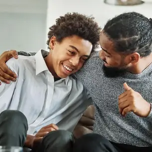 Florida father talking with his adult son who has a developmental disability, representing guardian advocacy support