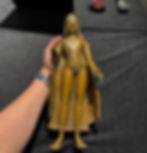 Examining a rare Kashmir copper alloy standing figure of Buddha Shakyamuni at Sotheby's London during Asian Art in London, November 2025