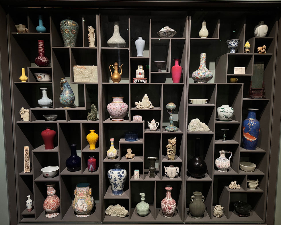 Cabinet of Chinese Imperial porcelain, jade, cloisonné enamel, and other decorative pieces at the Asian Art Museum in San Francisco