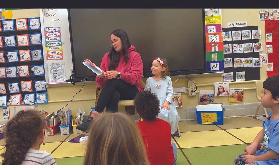 Carla Haggerty reads to her daughter Lily's class at the Montrose Early Childhood Center.