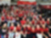 A sea of girls in red SOMA Hoops jerseys cheer on the Columbia High School Varsity Girls team during Spirit Night.