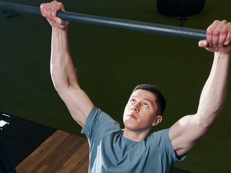 a man performing a dead hang