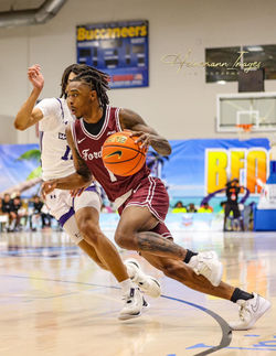 High School basketball players compete during a tournament on St