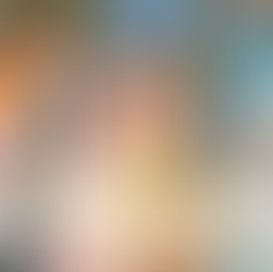 Children are playing with paint on top of a wall covered with a large canvas