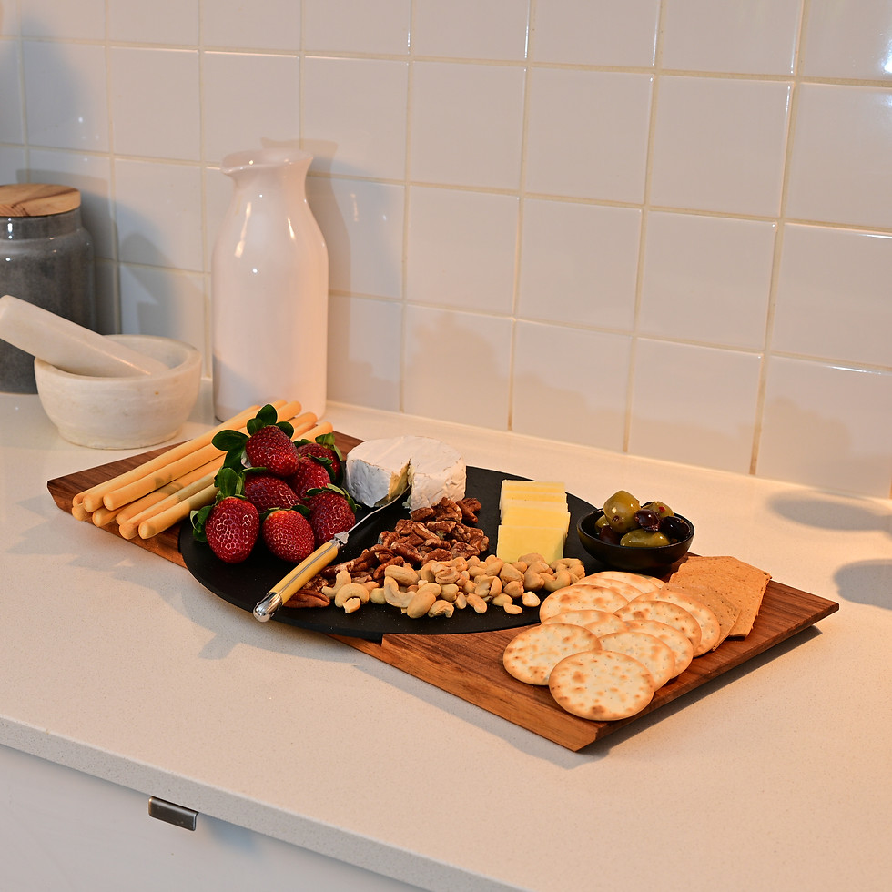 Thumbnail: DUO Charcuterie Board Set Large Round filled with charcuterie treats and crackers on a kitchen counter