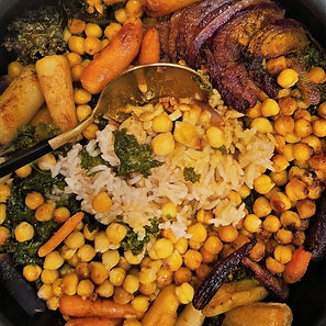 One-pot rice and chickpea stew with roasted carrots, kale, and caramelized onions