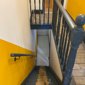 Hall, stairs and landing finished in Valspar paint in off-white, yellow and dark blue