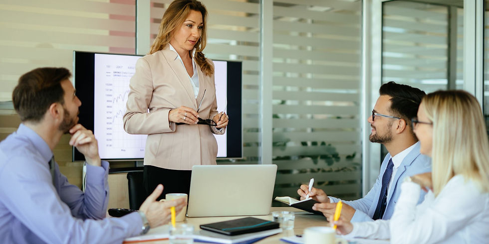 Professional taking initiative and ownership of their growth by leading a discussion in a workplace setting