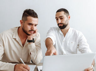 Leader working alongside team members to build connection, trust, and motivation in the workplace