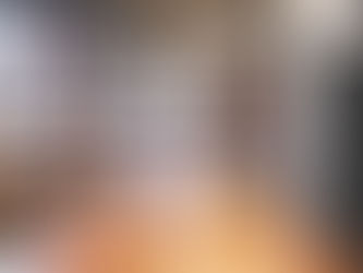 An employee working on a laptop in a conference room, symbolizing communication, leadership trust, and overcoming employee silence.