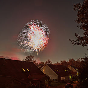 Fireworks over suburban homes