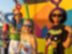 3 models wearing Teletubbies branded shirts and Teletubbies antenna headbands