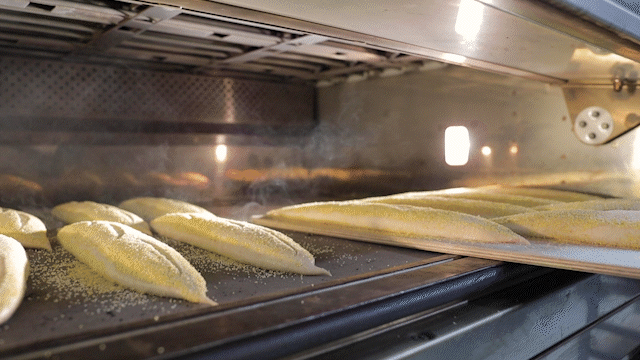 baguettes being baked in an oven