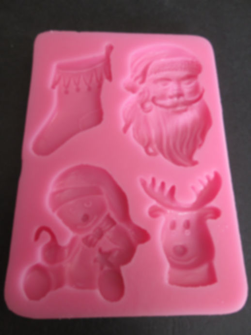 Moule en silicone thème Noël 4 sujets pour pâte à sucre