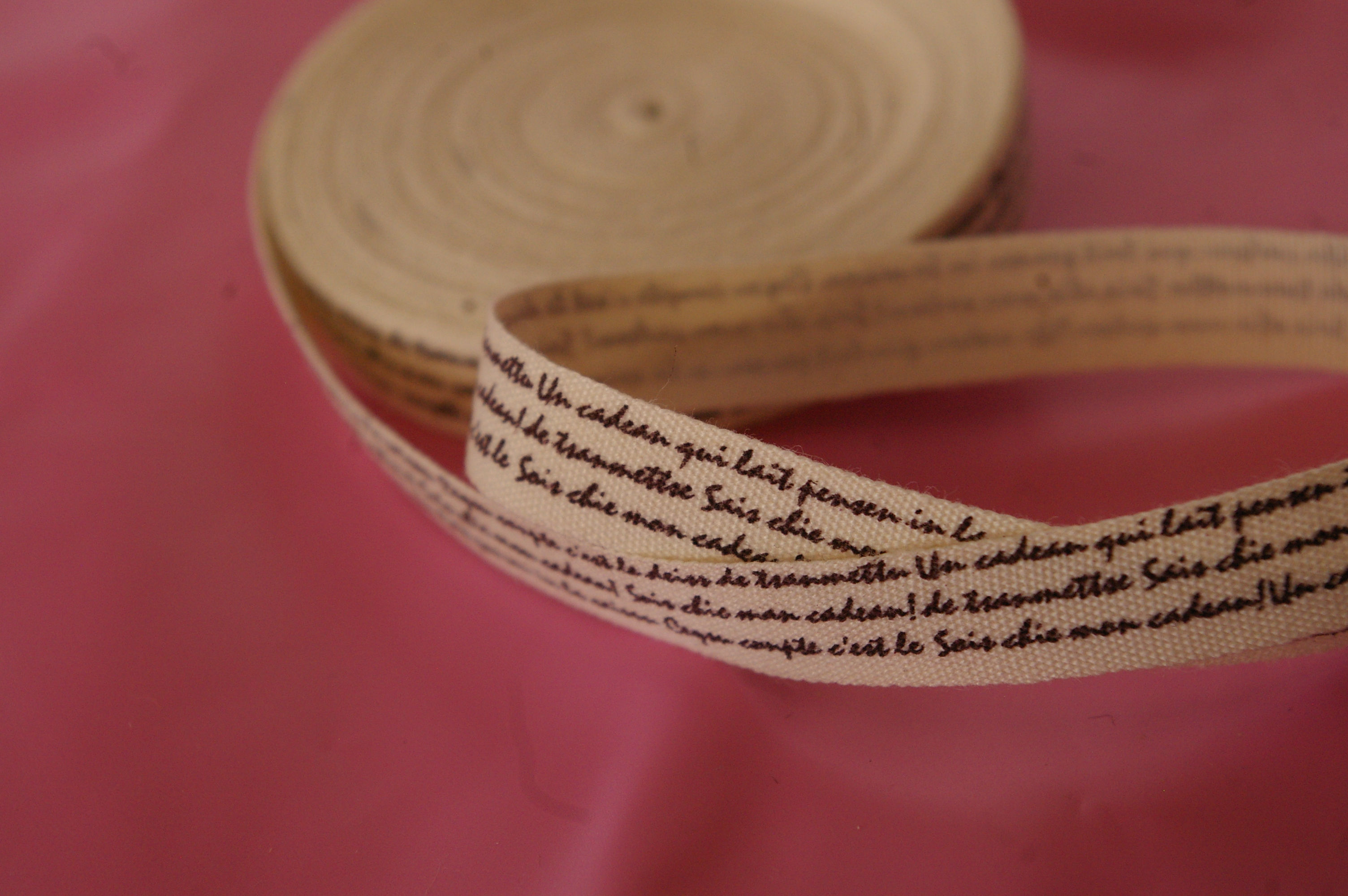 brown ribbon with dark brown writing in 9mm sold by the meter