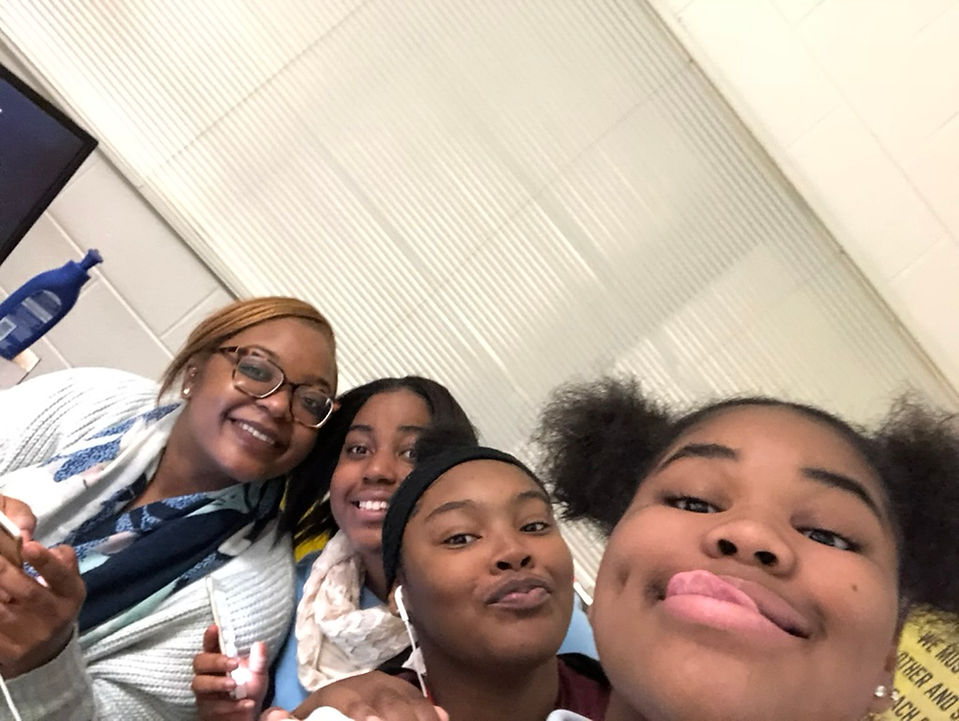 4 people smiling