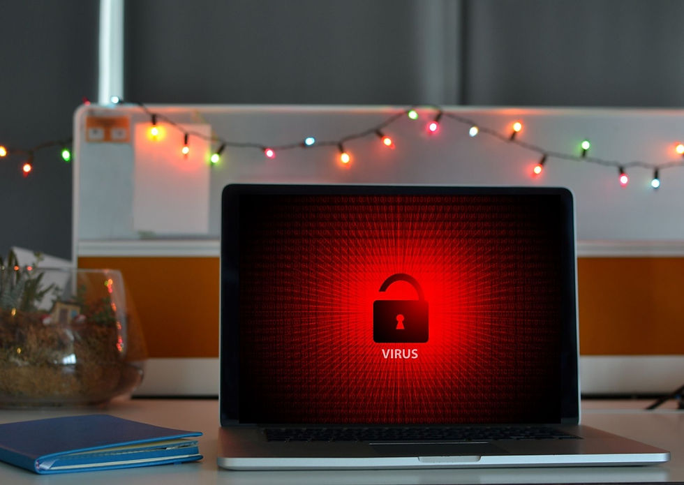 Laptop with a red virus warning screen on a desk, surrounded by colorful string lights. A notebook lies nearby, creating a tense mood.