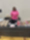 Woman with a table of cakes and catering desserts