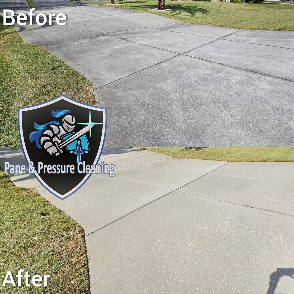 Technician pressure washing driveway to remove oil stains and dirt