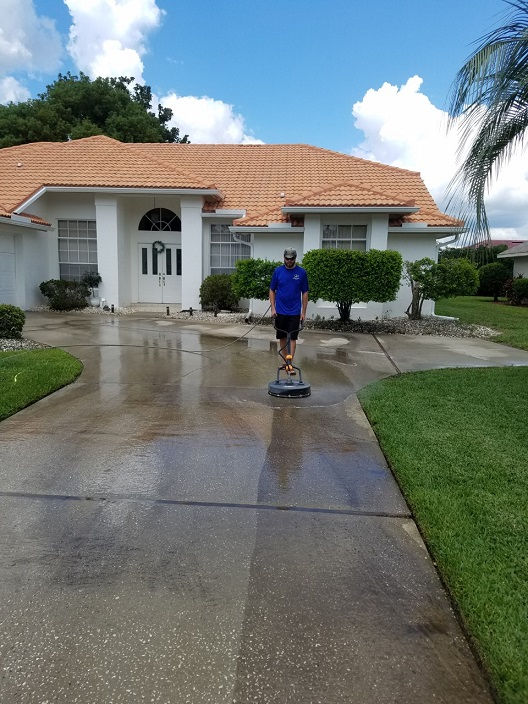Power washing services for residential concrete driveways
