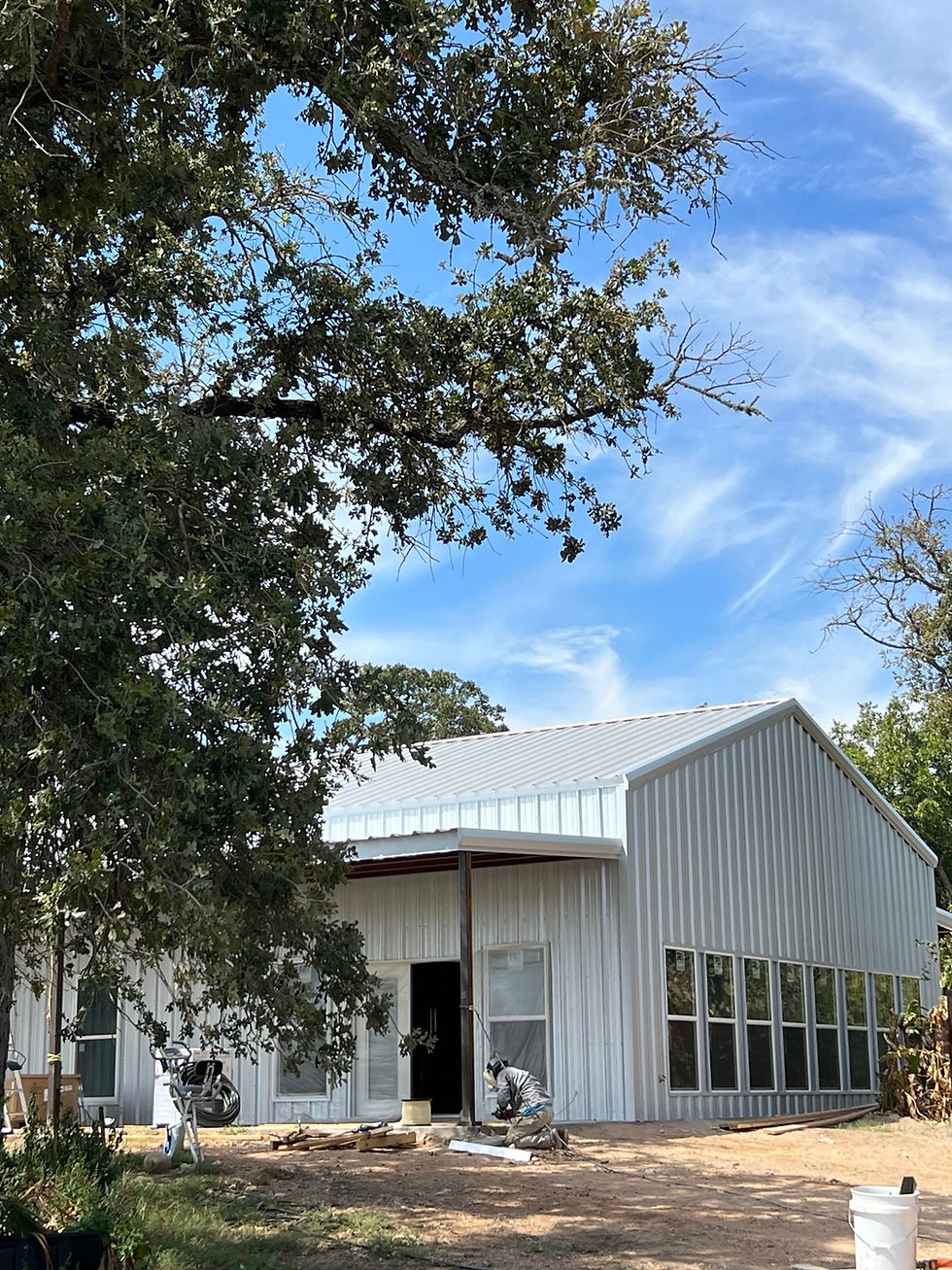 White metal building under construction