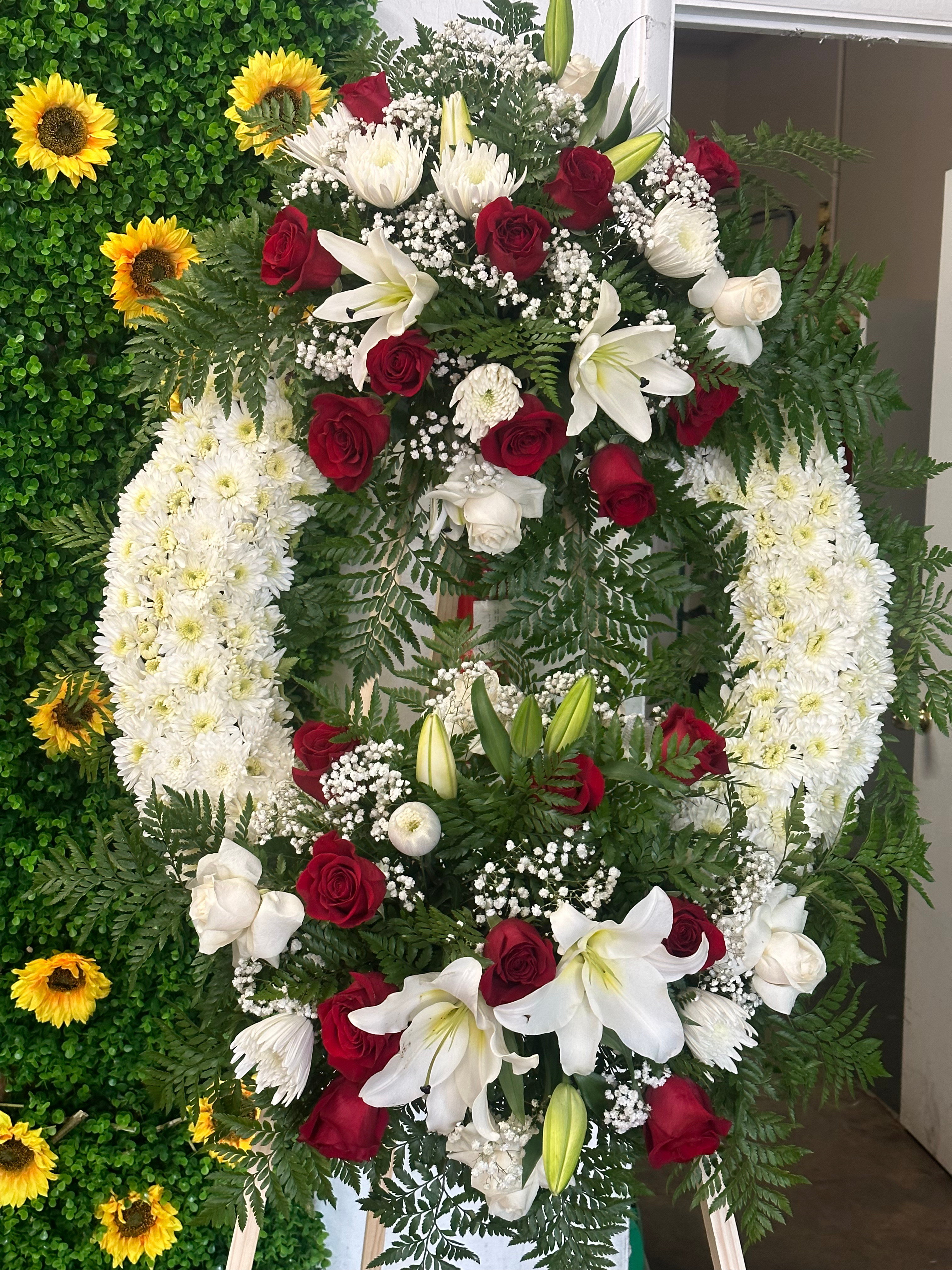 Red and white funeral wreath