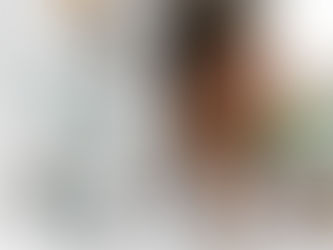 A person with radiant, dewy skin is captured in a moment of tranquility, their eyes closed and face tilted toward soft, natural light. Surrounding them are minimalist glass skincare bottles and floating, translucent drops of serum or water, symbolizing hydration and barrier health. The background is a soft-focus blend of sage green and cream tones, evoking a sense of "Skinimalism" and holistic wellness. The overall aesthetic is clean, science-backed, and serene.