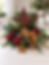 Rustic centerpiece with star, pinecones, and plaid ornaments