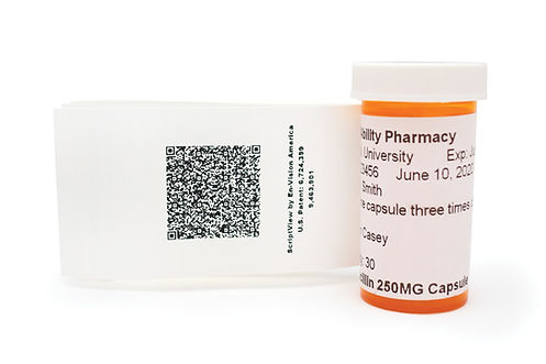 Photo of the ScriptView booklet label attached to a medication bottle. The label is opened to reveal a QR code underneath.