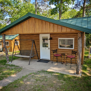 Front of cabin with glider rocker built for two