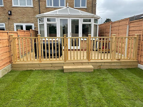 Deck with railing and grass