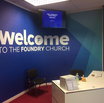 Large printed wall graphic on curved wall