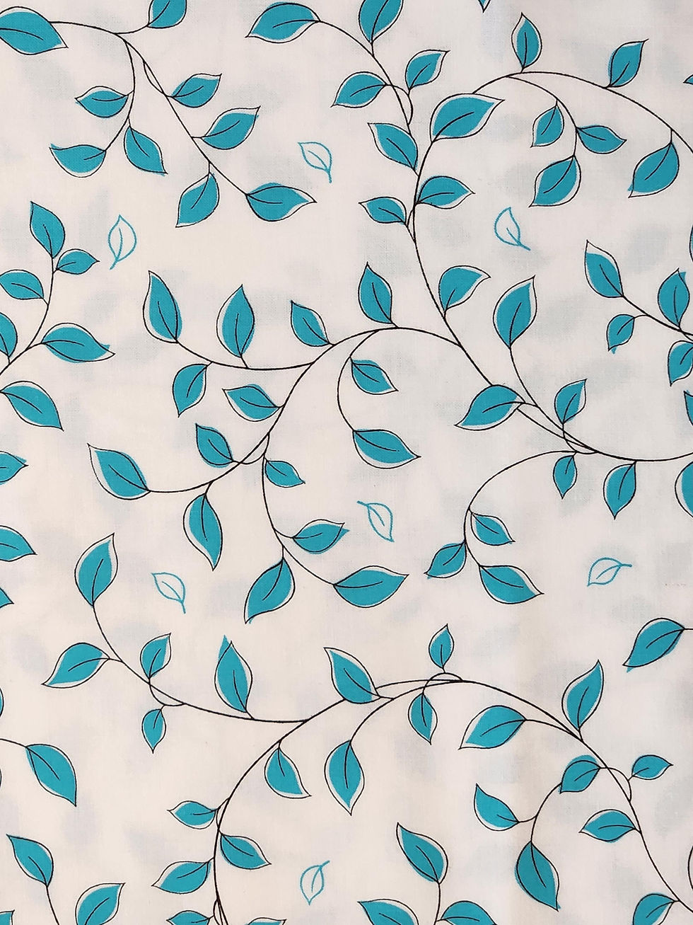 white fabric with blue leaves