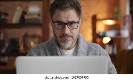 older-man-working-online-laptop-260nw-1917009950.webp