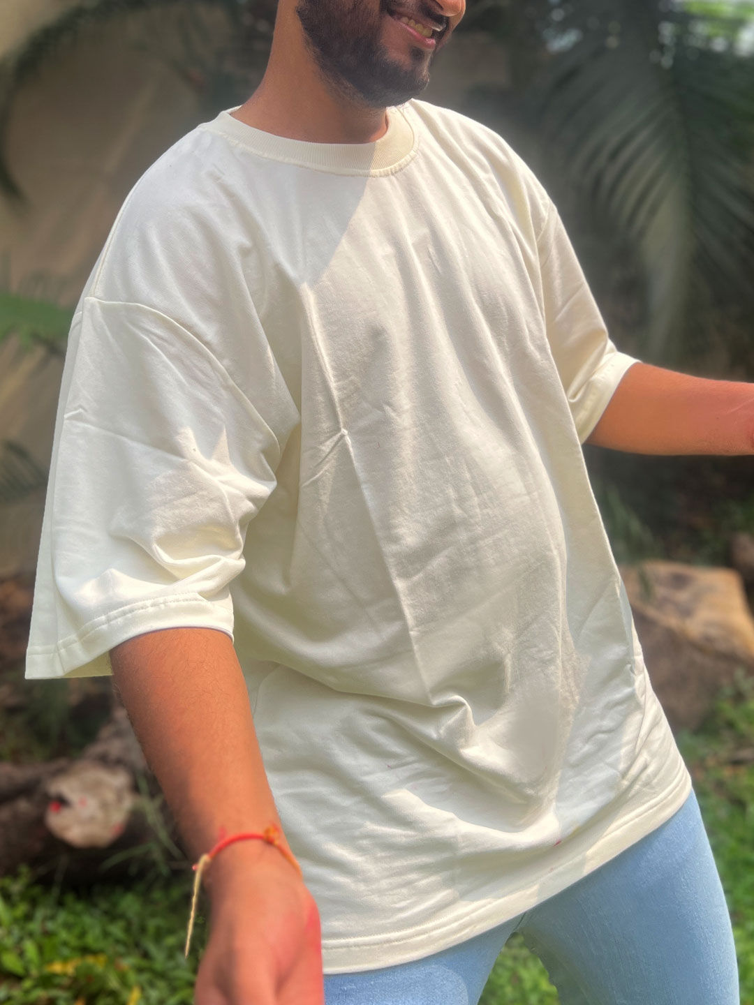 Man wearing Off White Oversize Tshirt side view close up